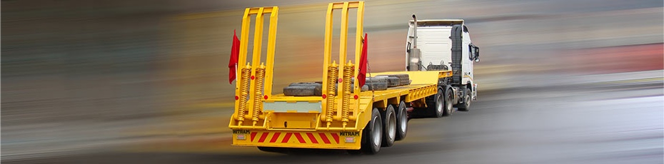 Yellow flatbed trailer